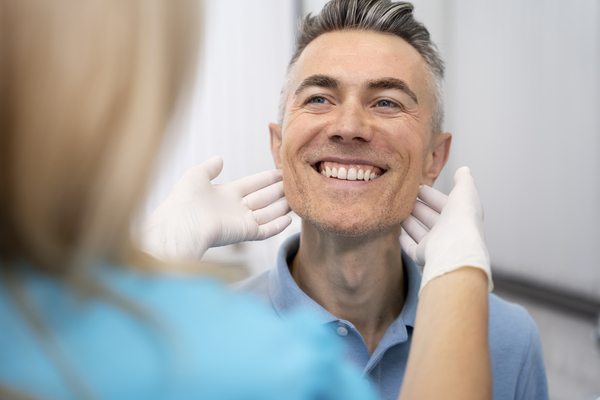 Smiling patient after getting dental implants at best dental clinic Kolkata