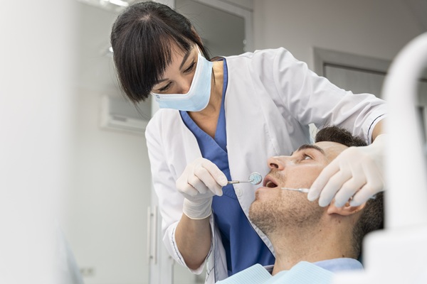 Root canal specialist treating infected tooth with care