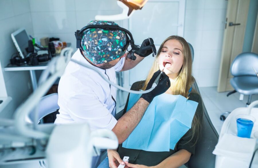 Dentist examining a patient during laser-assisted root canal treatment in Kolkata at Precision Dental.